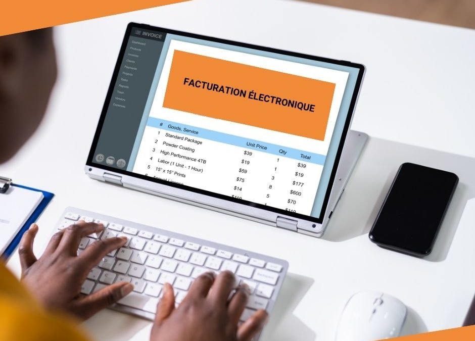 deux mains sur un clavier devant un écran portant la mention facturation électronique